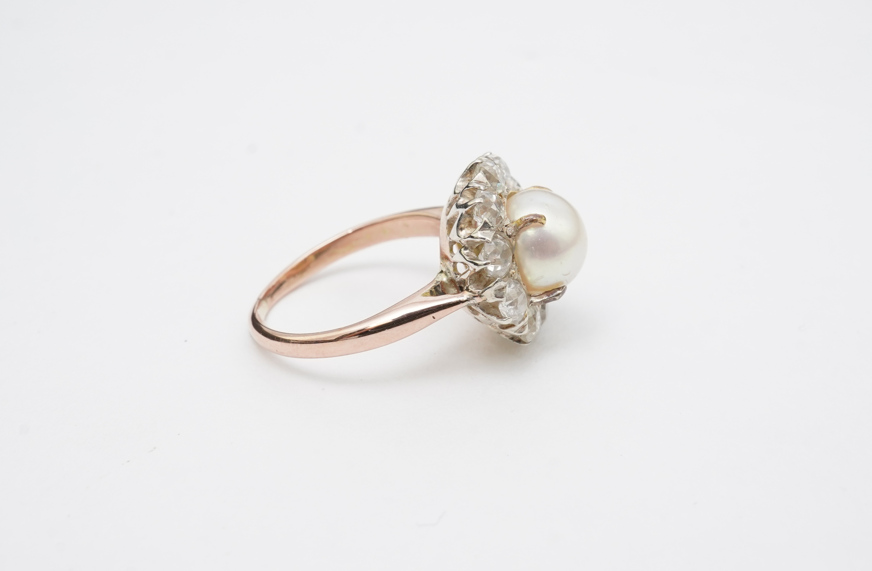 A cultured pearl and diamond ring